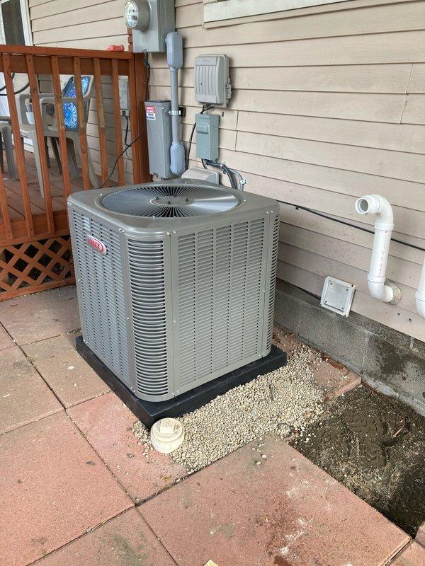 Completed full HVAC system installation including 70,000 BTU furnace, 2.5 ton Lennox air conditioning unit, humidifier, and chimney liner in rear yard location. Installed outdoor condenser unit on mounting pad with proper gravel base and concrete paver surround, routed PVC condensate drainage lines, established electrical connections with disconnect box, and reconnected all utility services. All mechanical and electrical permits obtained and system fully operational upon completion.
