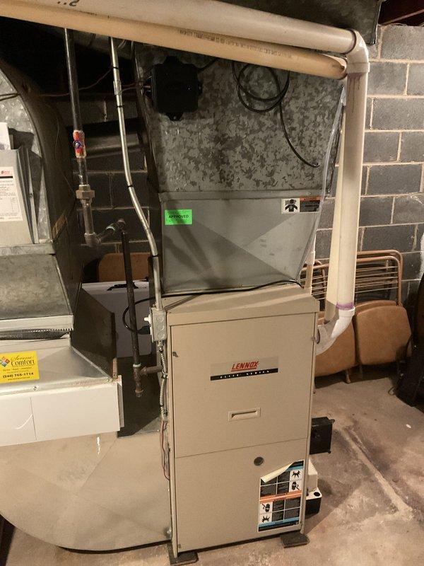 Completed warranty swap out installation of a 4-ton air conditioning system with matching evaporator coil in basement utility area. Installed Lennox vertical air handler with proper refrigerant line connections, condensate pump with drainage piping, and white PVC ventilation components. Connected electrical service, verified all mechanical and electrical connections per code requirements, and ensured proper operation of complete system including condensate removal. All permits obtained for mechanical and electrical work prior to installation. Unit properly mounted on concrete floor with all specification labels affixed and accessible for future service.