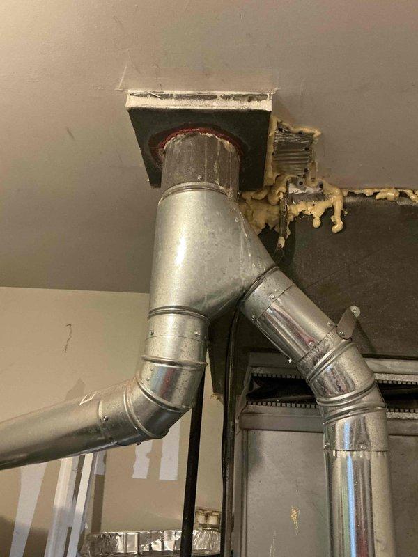 Provided estimate for air conditioning system replacement for a 5-year-old unit located in crawlspace with electric heating. The existing system is currently operational, but homeowner previously required complete ductwork replacement due to home addition work in 2021. Assessed existing metallic ductwork configuration including Y-junction ventilation piping and evaluated installation requirements for new equipment.
