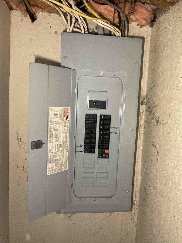 Conducted on-site assessment for new central air conditioning system installation at residential property currently without existing AC equipment. Evaluated electrical panel capacity and wiring infrastructure in utility area to determine compatibility for new system installation. Inspected exterior brick structure and identified optimal location for outdoor condenser unit placement with consideration for proper clearances and access requirements.