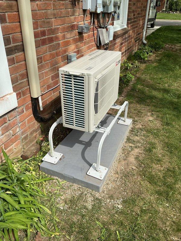 Completed callback to install level concrete pad under previously installed mini-split condenser unit. Unit was originally installed on uneven surface; returned to site to properly level and stabilize equipment per best practices. New concrete pad poured and cured, condenser repositioned and mounted on brackets to ensure proper drainage and equipment longevity. Verified all refrigerant lines, electrical connections, and condensate drainage remained secure and operational following relocation. Unit tested and confirmed running within manufacturer specifications.