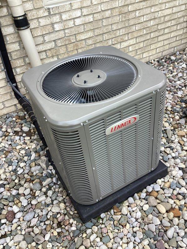 Completed annual preventive maintenance on Lennox residential air conditioning system. Performed comprehensive inspection of condenser unit, verified proper operation of fan motor and compressor, and documented equipment condition with photos showing coil assembly with normal dust accumulation for seasonal operation.