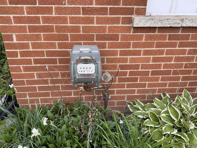 Completed comprehensive estimate for full HVAC system replacement including new furnace and air conditioning unit under promotional offer. Existing furnace is over 35 years old and property currently has no air conditioning system. Assessed installation requirements for whole house heating and cooling system, documented existing equipment conditions, and photographed exterior utility connections and potential equipment placement areas.
