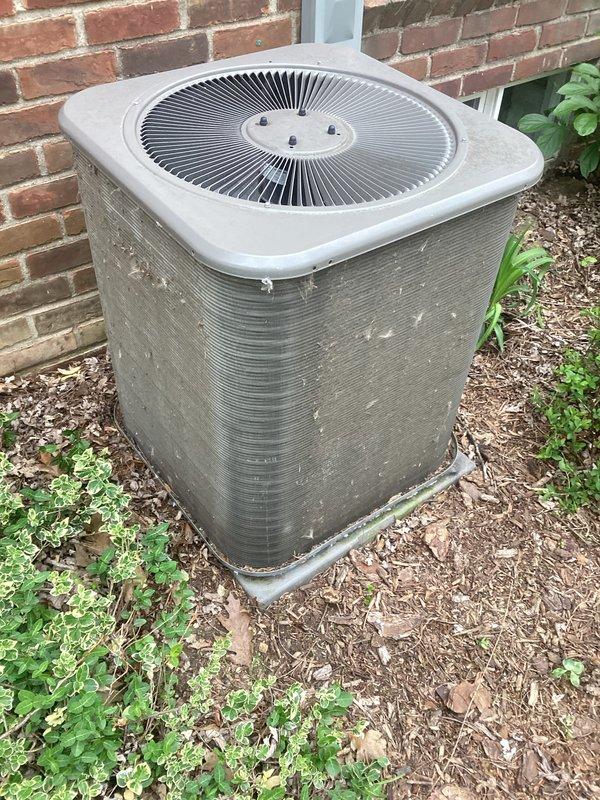 Completed annual cooling maintenance on outdoor condenser unit positioned against brick exterior. Performed comprehensive system inspection, verified operational status of fan motor and compressor, cleaned condenser coils, checked refrigerant levels, and tested electrical connections. Unit operating within normal parameters with no immediate service needs identified.