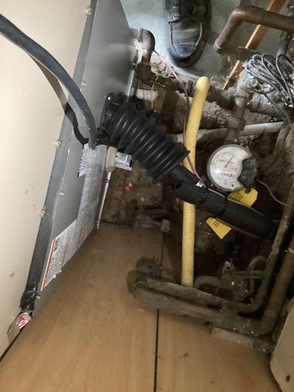 Completed full installation of 2-ton air conditioning system with matching evaporator coil at rear of residence. Installed new outdoor condensing unit on pad with proper refrigerant line connections, electrical disconnect, and secure mounting to exterior wall. Indoor evaporator coil installed in mechanical room with new refrigerant lines, proper drainage connections, and electrical reconnection to existing system. All mechanical and electrical permits obtained prior to installation. System startup completed with refrigerant charge verification, airflow testing, and operational checks confirming proper cooling performance across all parameters.