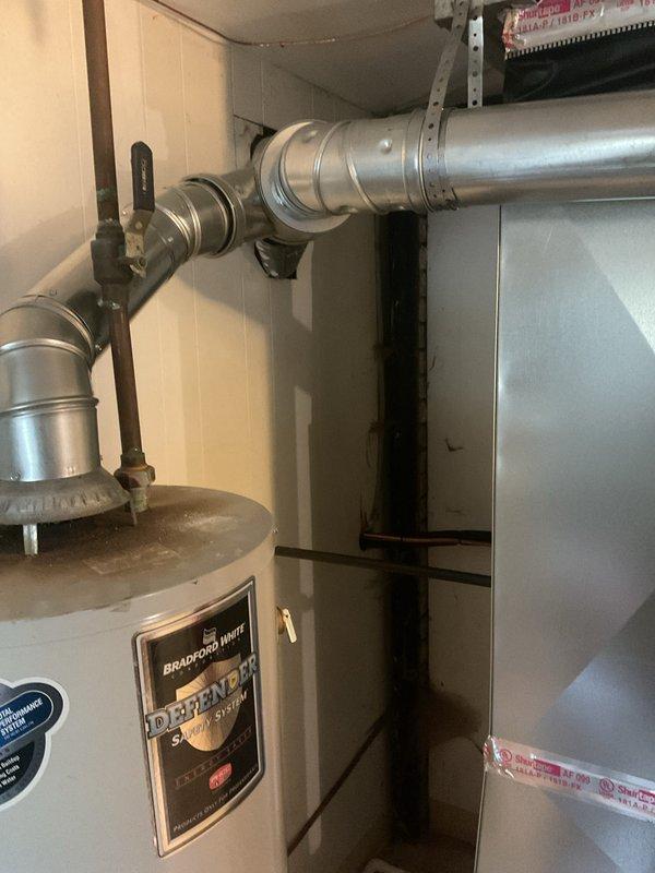 Completed full HVAC system installation including 70,000 BTU Lennox furnace and 2.5 ton air conditioning unit in residential basement utility area. Obtained mechanical and electrical permits prior to installation, installed new furnace and AC condenser unit in rear yard, connected all ductwork and refrigerant lines, and reconnected existing system components. All equipment tested and operational upon completion.