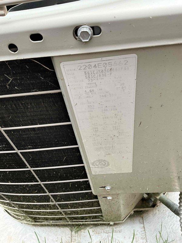 Provided comprehensive replacement estimate for 22-year-old residential HVAC system including air conditioning condenser unit and natural gas furnace located in basement. Evaluated existing equipment which is currently operational but nearing end of service life, documented current system configuration with outdoor condenser positioned on concrete pad adjacent to brick foundation, and presented options for complete system replacement under BOGO promotion.