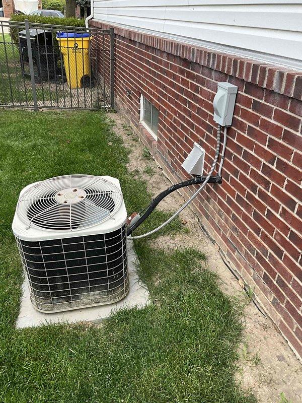 Provided comprehensive replacement estimate for 22-year-old residential HVAC system including air conditioning condenser unit and natural gas furnace located in basement. Evaluated existing equipment which is currently operational but nearing end of service life, documented current system configuration with outdoor condenser positioned on concrete pad adjacent to brick foundation, and presented options for complete system replacement under BOGO promotion.