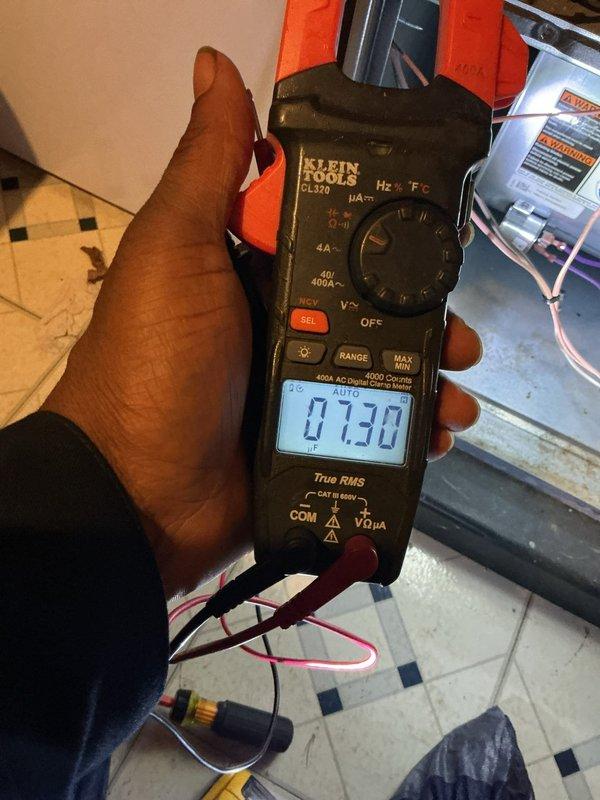 Completed annual cooling maintenance inspection on residential HVAC system. Performed comprehensive system diagnostics using Klein Tools CL370 digital multimeter and 600A AC digital clamp meter to verify electrical performance, measuring voltage and amperage readings at 7.30 units to ensure proper operation. All electrical components tested within normal operating parameters and system functioning as designed.