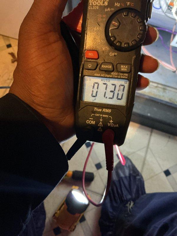 Completed annual cooling maintenance inspection on residential HVAC system. Performed comprehensive system diagnostics using Klein Tools CL370 digital multimeter and 600A AC digital clamp meter to verify electrical performance, measuring voltage and amperage readings at 7.30 units to ensure proper operation. All electrical components tested within normal operating parameters and system functioning as designed.