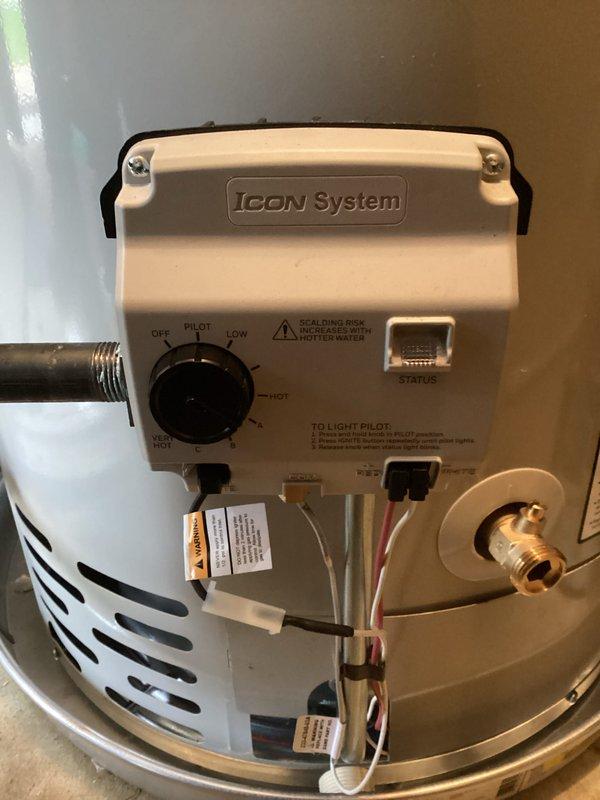 Installed a 40-gallon tanked water heater in residential utility area, including proper venting with metallic exhaust pipe system routed vertically through ceiling. Connected copper supply lines with shutoff valve, installed Icon System gas control unit with temperature regulation dial, and secured all gas line connections. Mechanical permit obtained for water heater installation and reconnection; all components tested and operational upon completion.