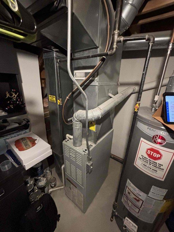Completed comprehensive HVAC estimate for full system replacement in basement installation serving small to mid-sized residential space up to 1200 square feet. Assessed existing heating and cooling equipment including aged furnace unit and water heater, documenting significant deterioration of metal piping and conduit connections with extensive rust, corrosion, and paint failure indicating moisture exposure and end-of-service-life conditions. Provided detailed quote for natural gas or propane-fired heating and cooling system replacement with properly sized equipment and updated ductwork connections to address current system deficiencies.