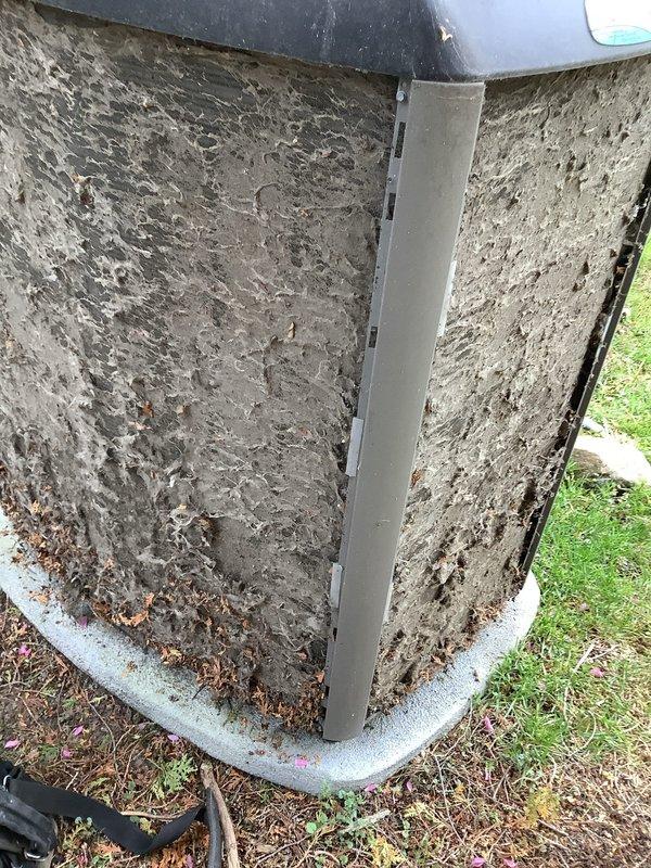 Responded to service call for forced air furnace with humidifier pump cycling issue. Diagnosed and repaired humidity/water pump that was continuously turning on and off regardless of water level in reservoir. Performed seasonal AC tune-up including inspection of outdoor condenser unit, cleaned accumulated debris from exterior panels and base, checked refrigerant levels, and verified proper system operation. System restored to normal heating function with humidifier operating correctly on demand only.