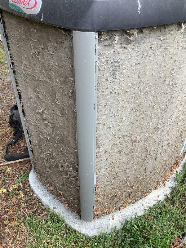 Responded to service call for forced air furnace with humidifier pump cycling issue. Diagnosed and repaired humidity/water pump that was continuously turning on and off regardless of water level in reservoir. Performed seasonal AC tune-up including inspection of outdoor condenser unit, cleaned accumulated debris from exterior panels and base, checked refrigerant levels, and verified proper system operation. System restored to normal heating function with humidifier operating correctly on demand only.