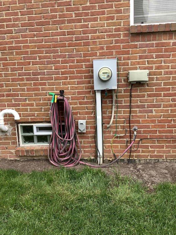 Completed electrical estimate for new whole home generator installation at residential property. Evaluated existing electrical panel location in basement utility area and assessed exterior meter and service entry point on brick wall to determine optimal generator placement and electrical integration requirements. Documented current electrical infrastructure including panel capacity, conduit routing, and utility meter configuration to provide comprehensive proposal for generator system installation and transfer switch integration.