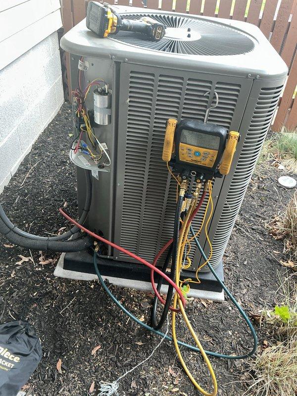 Responded to recall for 2-year-old Lennox central air conditioning system not cooling below 75°F following recent annual maintenance by another provider. Performed comprehensive diagnostic evaluation using digital manifold gauges to measure refrigerant pressures and system temperatures on outdoor condenser unit. Applied leak detection dye (Spectroline 2-6 ton system) to identify potential refrigerant leaks in the system, as low cooling capacity following recent service suggested possible refrigerant loss or system compromise during previous maintenance work.