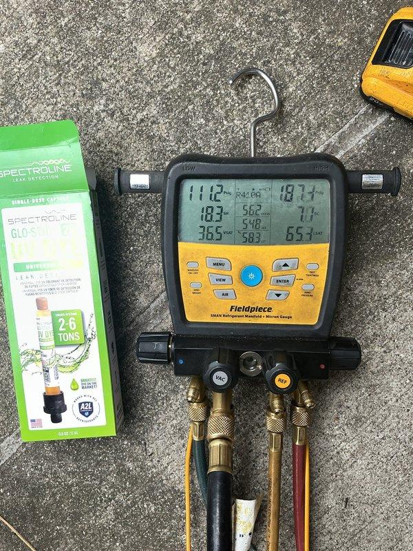 Responded to recall for 2-year-old Lennox central air conditioning system not cooling below 75°F following recent annual maintenance by another provider. Performed comprehensive diagnostic evaluation using digital manifold gauges to measure refrigerant pressures and system temperatures on outdoor condenser unit. Applied leak detection dye (Spectroline 2-6 ton system) to identify potential refrigerant leaks in the system, as low cooling capacity following recent service suggested possible refrigerant loss or system compromise during previous maintenance work.