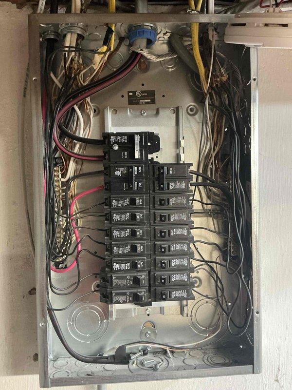 Completed full system estimate for HVAC replacement on property with 16-year-old furnace requiring immediate replacement. Assessed existing exterior HVAC unit with associated refrigerant lines, electrical conduit routing, and ground-level installation conditions including weathered paver base and gravel bed. Evaluated electrical panel capacity and circuit breaker configuration to determine compatibility with new system requirements, documenting current wiring arrangement and available panel capacity for upgraded equipment installation.