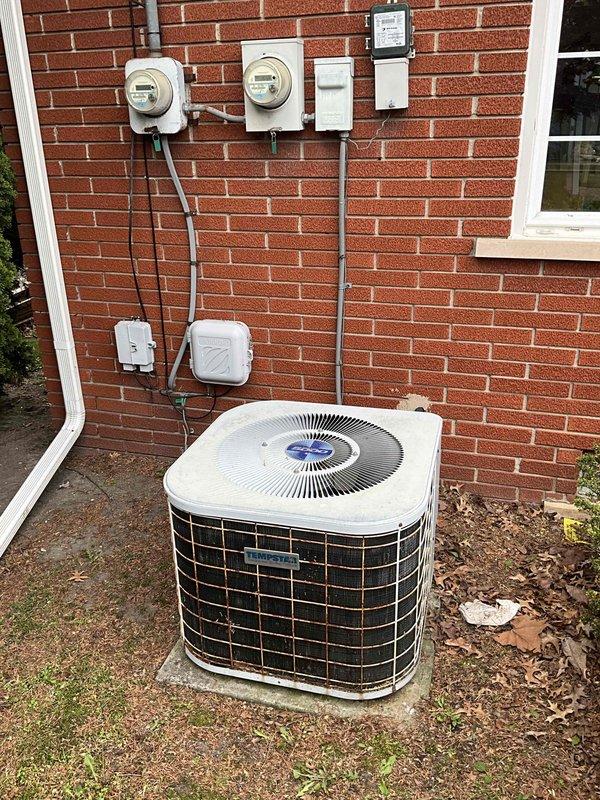 Conducted comprehensive site evaluation for complete HVAC system replacement including 30-year-old Tempstar furnace and outdoor condensing unit. Both systems currently operational but recommended proactive replacement due to age and to prevent unexpected failure. Documented existing equipment configuration including furnace with Space-Gard air cleaner, water heater placement, electrical service connections with dual meters and disconnect, outdoor unit positioning on concrete pad, ductwork routing, and PVC drainage system. Photographed all major components and utility connections for estimate preparation. Provided customer with replacement options for matched heating and cooling system.