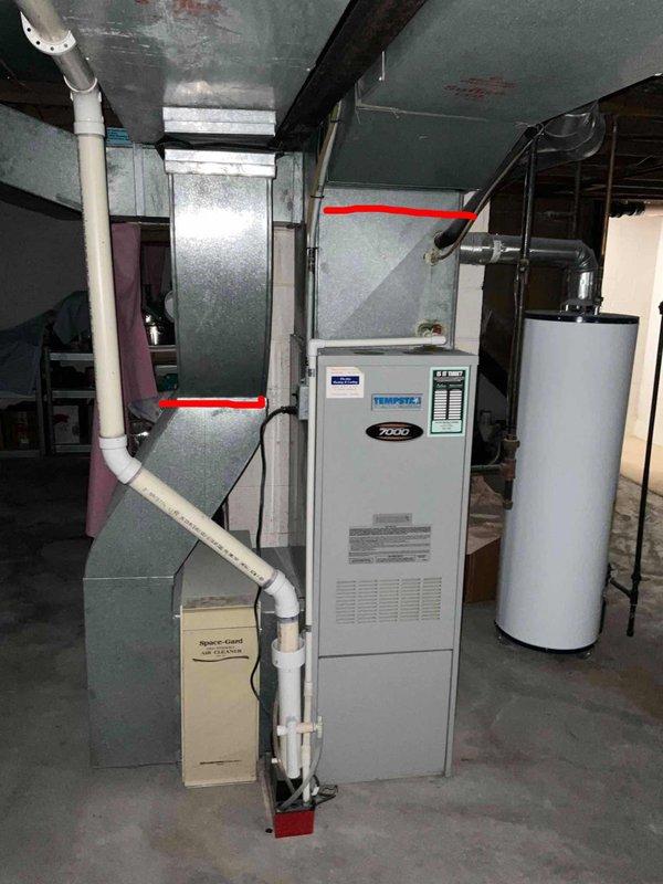 Conducted comprehensive site evaluation for complete HVAC system replacement including 30-year-old Tempstar furnace and outdoor condensing unit. Both systems currently operational but recommended proactive replacement due to age and to prevent unexpected failure. Documented existing equipment configuration including furnace with Space-Gard air cleaner, water heater placement, electrical service connections with dual meters and disconnect, outdoor unit positioning on concrete pad, ductwork routing, and PVC drainage system. Photographed all major components and utility connections for estimate preparation. Provided customer with replacement options for matched heating and cooling system.