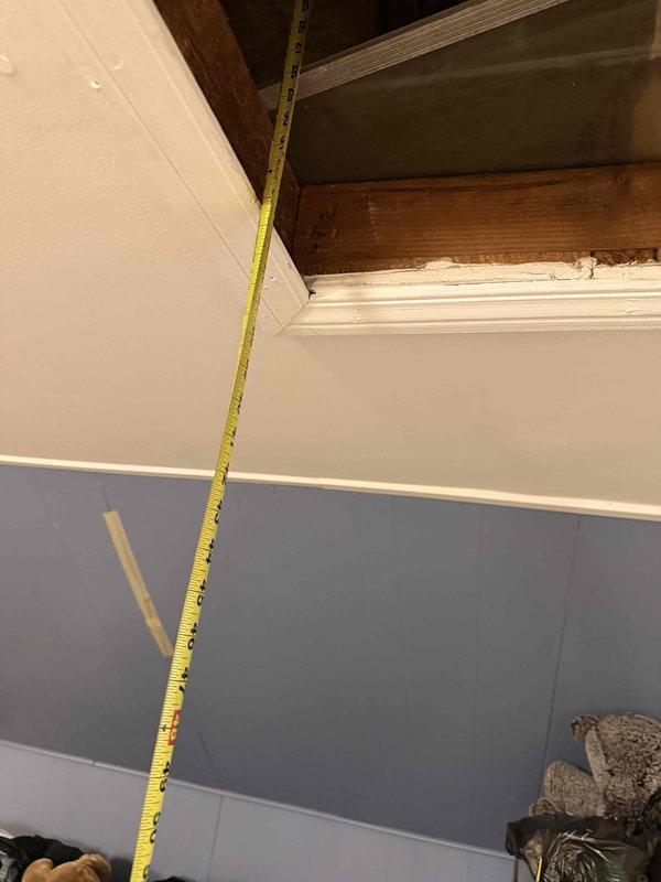 Performed comprehensive measurements of existing attic ductwork system to prepare accurate estimate for ductwork modifications or replacement. Accessed attic space through interior ceiling hatch, documented vertical clearances and opening dimensions, and photographed existing conditions to support proposal development for previously quoted HVAC system installation.