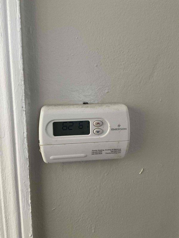 Conducted comprehensive full system HVAC evaluation for residential property with 10-year-old furnace requiring replacement. Assessed basement installation area with existing water heater, ductwork configuration, and current Emerson thermostat system reading 62°F. Documented equipment conditions, measured available space for new furnace installation, evaluated existing duct system compatibility, and provided complete replacement system specifications to address heating needs within customer's one-month timeline.