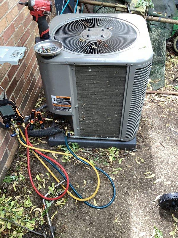 Completed annual preventative maintenance on residential air conditioning system. Connected refrigerant gauges to service ports, verified system pressures and temperatures, inspected condenser unit operation including fan motor and compressor function. Cleaned condenser coil, checked electrical connections, and confirmed proper airflow through unit. System operating within normal parameters with no deficiencies noted.