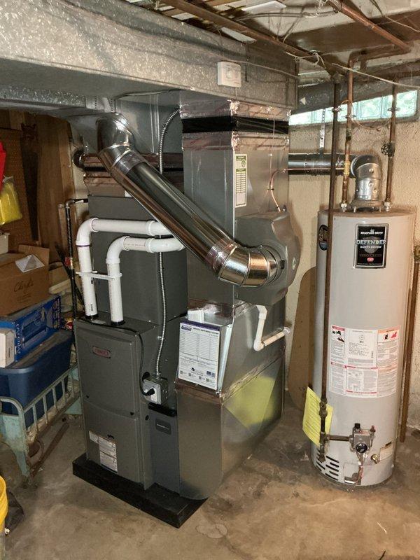 Completed full HVAC system installation including a 70,000 BTU furnace and 2.5 ton air conditioning unit with rear discharge configuration. Installation included humidifier integration, ductwork liner, electrical panel connections, and all necessary mechanical and electrical reconnections. Obtained required mechanical and electrical permits prior to installation, with all work completed to code specifications and system tested for proper operation.