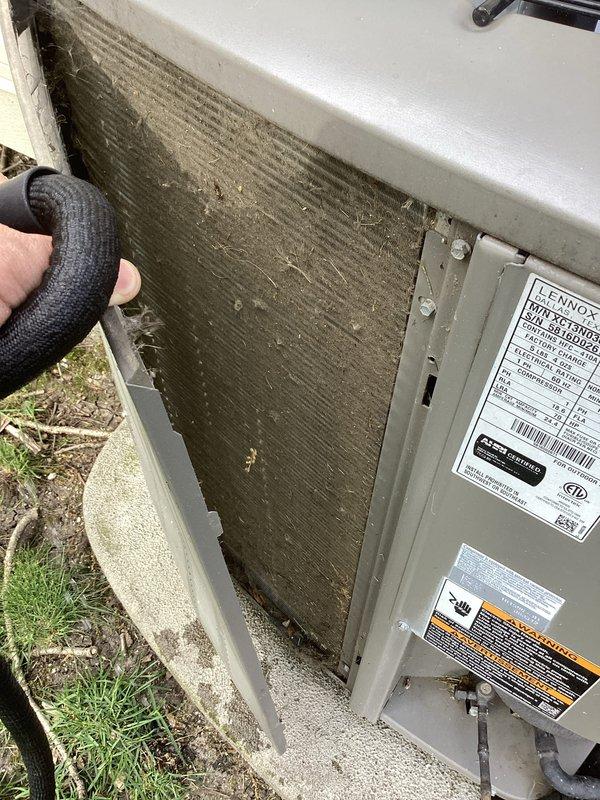 Performed annual cooling maintenance on Lennox HVAC system. Upon arrival, contacted customer as requested before beginning work. Inspected outdoor condensing unit and found evaporator coil heavily contaminated with dirt and debris accumulation. Cleaned coil thoroughly to restore proper airflow and system efficiency. Inspected electrical panel and internal wiring connections, verified capacitor condition, and checked contactor operation. Replaced air filter. Documented system condition with photographs showing before condition of soiled coil and electrical components. All components tested and operating within normal parameters upon completion.