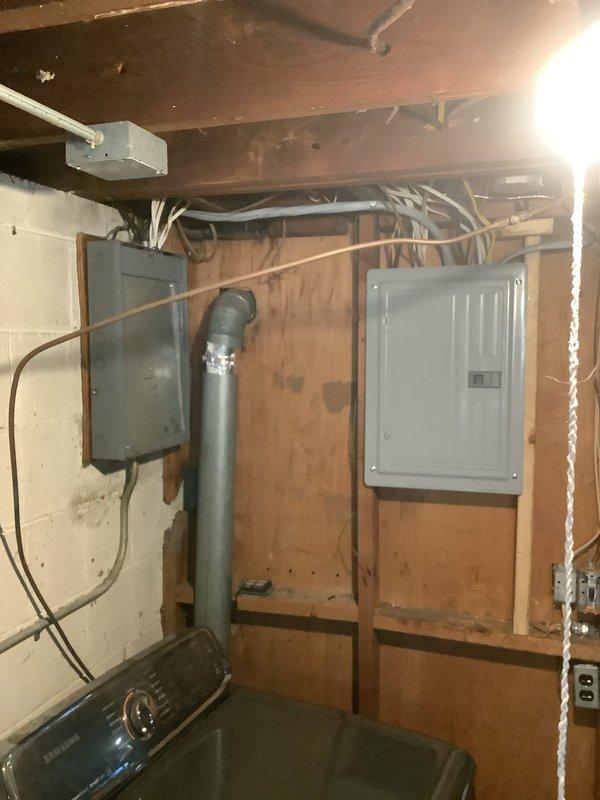 Successfully installed a new 100-amp electrical service panel in the basement utility area with proper conduit routing and circuit connections. All required permits were obtained prior to installation, and work was completed in accordance with local electrical codes. The installation included integration with existing mechanical and HVAC systems, including provisions for a 2-ton air conditioning unit and new dedicated circuits.