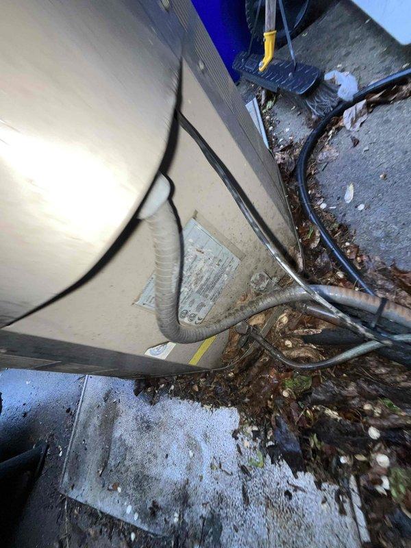 Conducted full system evaluation for 1500 square foot residential property with 16-year-old air conditioning unit requiring replacement. Inspected outdoor condensing unit showing significant debris accumulation around base and concrete pad, with visible wear on exterior casing and associated drainage components. Assessed indoor air handler and furnace assembly in basement mechanical room, including existing humidifier integration and ductwork configuration. Documented current equipment specifications, electrical connections, and refrigerant line routing to provide comprehensive replacement options for complete HVAC system upgrade within customer's requested two-week timeline.
