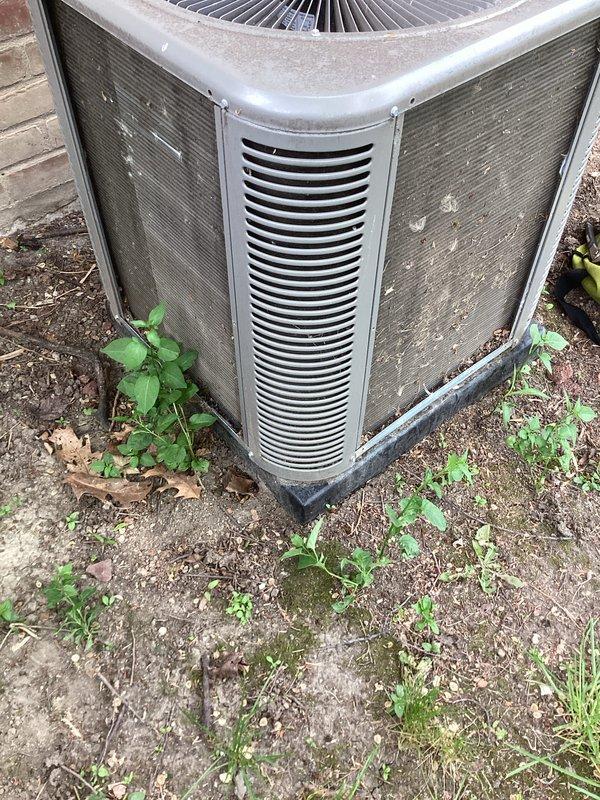 Completed annual cooling maintenance on outdoor condenser unit. Performed system inspection, replaced air filter and evaporative cooler pad, cleaned condenser coils and cabinet surfaces of accumulated dirt and debris, and cleared vegetation growth from around unit perimeter to ensure proper airflow and operation.