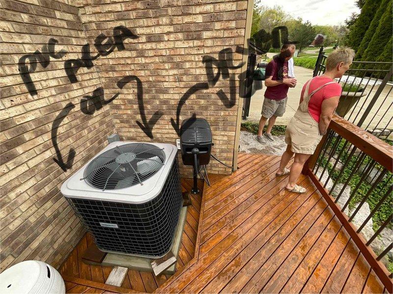 Completed new installation of tankless water heater at outdoor location adjacent to existing HVAC condenser unit. Unit mounted on exterior brick wall with proper venting, gas line connection, and electrical disconnect installed per manufacturer specifications and local code requirements.