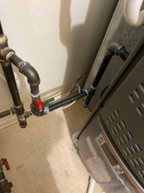 Completed violation repairs on HVAC installation including installation of combustion air supply to mechanical room, added missing sediment trap on gas line to furnace, and installed fire stops around chimney penetration, refrigerant lineset, and gas line penetrations. All work brought system into compliance with applicable mechanical and fire safety codes.