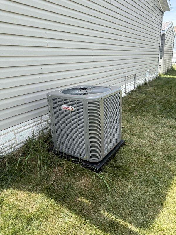 Completed full HVAC system installation including a 70,000 BTU furnace installed in interior closet with louvered door for proper ventilation, and a 2.5 ton Lennox air conditioning condenser unit positioned on pad at rear exterior of residence. All mechanical connections, electrical reconnections, and refrigerant lines were completed per manufacturer specifications, with permits obtained and all required paperwork finalized.