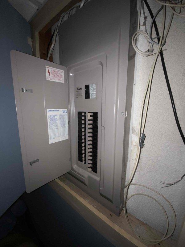 Conducted comprehensive assessment of 16-year-old HVAC system to provide full replacement estimate. Inspected existing air conditioning unit and furnace, both at end of service life. Evaluated electrical panel configuration and capacity for new system installation. Documented deteriorated ductwork in attic space, noting compromised elbow joint with visible insulation damage and significant dust accumulation throughout system. Assessed structural support requirements and existing duct connections. Provided detailed replacement quote for complete system upgrade including new furnace, air conditioner, and necessary ductwork modifications to address identified deficiencies.