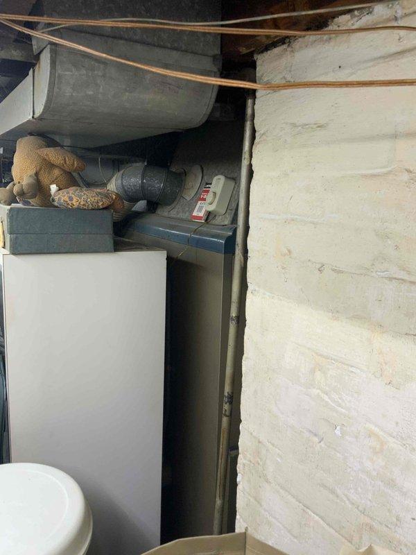 Provided estimate for replacement of 76-year-old furnace and non-operational air conditioning system located in basement. Assessed existing HVAC equipment, ductwork configuration, and utility connections including water heater proximity and available space for new installation. Documented current system conditions and mechanical room layout to prepare comprehensive replacement proposal for both heating and cooling units.
