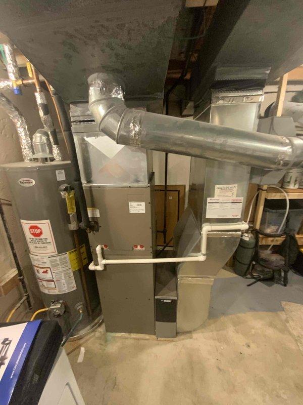 Conducted full system estimate for 16-year-old residential air conditioning system requiring immediate replacement. Assessed existing HVAC equipment located in basement utility room, including furnace unit, ductwork configuration, electrical panel capacity, and mechanical infrastructure to determine replacement specifications and compatibility requirements. Documented current system condition and mechanical room layout with photographs to support comprehensive replacement proposal.