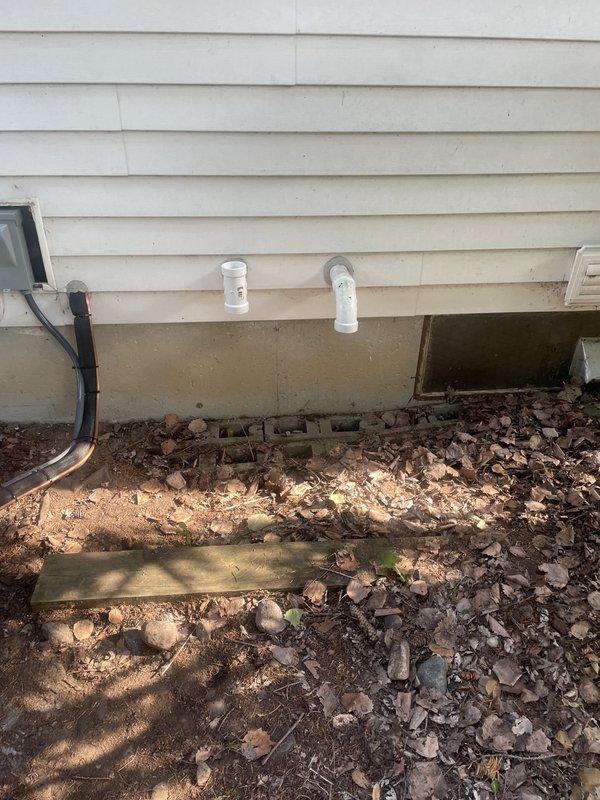Successfully completed installation of a 2-ton air conditioning system with evaporator coil at rear exterior location. The outdoor condenser unit was positioned on an existing concrete pad adjacent to the foundation, with refrigerant lines properly insulated and routed to the house. Electrical disconnect box was installed on the exterior wall for service accessibility, and all refrigerant connections were completed and secured. Permits were requested for mechanical and air conditioning work prior to installation, and all components were reconnected and commissioned per manufacturer specifications.