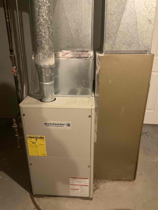 Completed HVAC estimate for replacement of existing Kelvinator heating and cooling system in residential duplex unit. Documented current equipment condition including furnace, ductwork configuration, and surrounding utility infrastructure to provide comprehensive replacement recommendations and specifications.