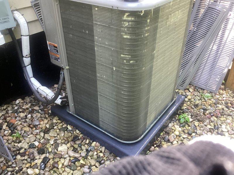 Completed comprehensive AC tune-up and furnace maintenance on 10-year-old HVAC system at recently purchased condo. Outdoor condenser unit showed significant dirt and debris accumulation on coil fins and housing, requiring thorough cleaning to restore proper airflow and heat transfer efficiency. Addressed neglected humidifier with moldy filter and foul odor by replacing filter media and sanitizing unit. Performed standard maintenance procedures including refrigerant level check, electrical connections inspection, thermostat calibration, and system operational testing. All components now functioning properly with improved air quality and system performance restored.