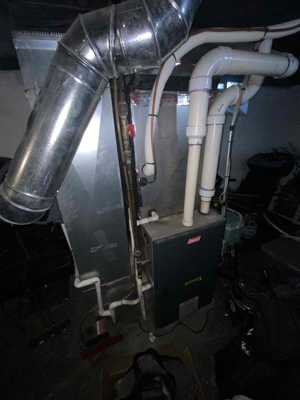 Provided estimate for complete air conditioning system replacement in basement location. Current 15+ year old unit is non-operational and requires full system replacement including outdoor condenser, indoor evaporator coil, and associated refrigerant lines and electrical connections.