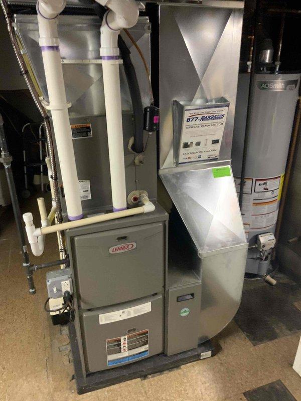 Conducted comprehensive evaluation of existing 12-year-old residential air conditioning system for replacement estimate. Assessed outdoor condenser unit condition, electrical connections, and refrigerant line set integrity. Documented current system configuration including indoor Lennox furnace with existing ductwork plenum and outdoor AC unit mounted on concrete pad. Photographed equipment specifications, installation setup, and accessibility for future replacement planning. Provided detailed replacement options and recommendations to customer for system upgrade consideration.