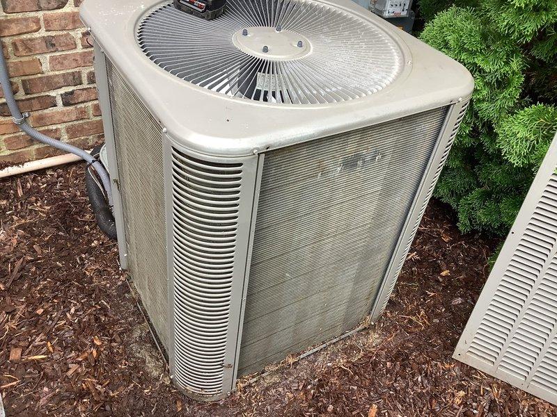 Responded to no-cooling complaint on dual 6-year-old Lennox systems. Upon arrival, verified both outdoor condenser units were operational with fans running and compressors cycling properly. Confirmed thermostat batteries had been recently replaced and air filters changed by homeowner with no improvement in cooling performance. Performed diagnostic testing on both systems including refrigerant pressure checks, electrical component verification, and airflow measurements. Both Trane and Lennox condensers showed normal operating parameters with adequate airflow through coils despite visible exterior weathering and debris accumulation on cabinet surfaces. Systems restored to proper cooling operation.