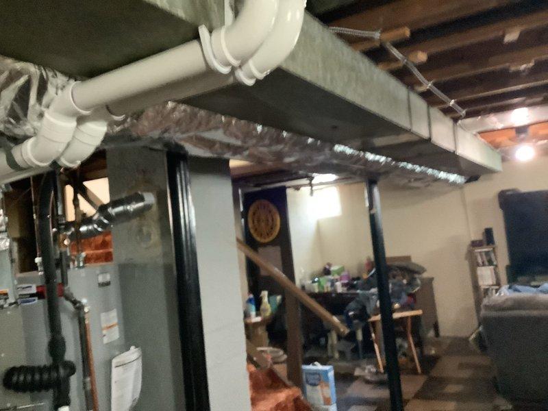 Picked up insulation materials from shop and installed insulation on exposed supply ductwork in basement area. Applied flexible insulated wrapping to previously uninsulated metal ductwork runs extending from air handler unit across ceiling joists. Work completed under full warranty coverage with no charge to customer.