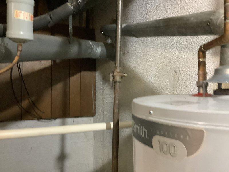 Responded to no-heat call on 49-year-old furnace installed in 1977. Upon arrival, unit was shut down due to rumbling sounds reported throughout the day with no heat or airflow to home. Conducted thorough inspection of basement-mounted furnace and found system had reached end of serviceable life with multiple mechanical failures. Unit had history of frequent breakdowns during previous heating season and was previously flagged for replacement. Heat exchanger showed signs of severe deterioration consistent with age, and blower assembly exhibited excessive wear causing abnormal noise during operation. Thermostat malfunction also noted, as home temperature had recently climbed to 82°F despite 72°F setpoint, indicating failed heating/cooling control. Given the age of equipment, extent of mechanical degradation, safety concerns with heat exchanger integrity, and cost of necessary repairs versus replacement, recommended immediate system replacement. Provided customer with options for new high-