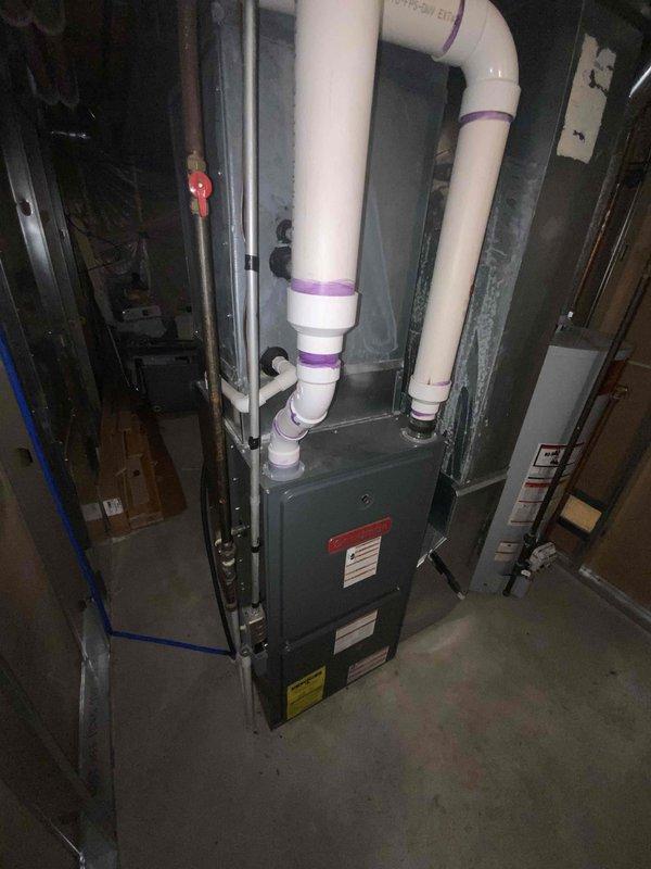Provided comprehensive estimate for complete HVAC system replacement in basement location, including non-functional air conditioning unit and furnace dating from 1985. Assessed existing equipment configuration with water heater, evaluated current ductwork connections, PVC venting arrangements, and available space constraints for new installation recommendations.