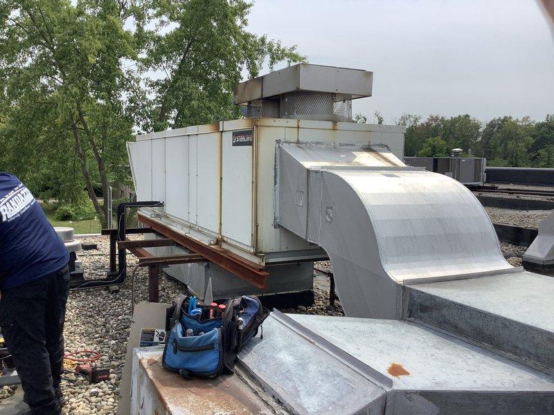 Responded to service call for non-operational rooftop unit that required specialized equipment not available during previous visit. Performed diagnostic assessment on Sterling-branded RTU located on commercial rooftop alongside multiple other HVAC units. Identified system failure, completed necessary repairs using appropriate tools and equipment, and restored unit to operational status.