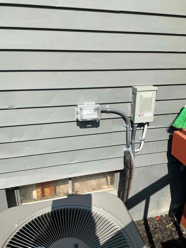 Completed full HVAC system installation including a 70,000 BTU furnace and 2-ton air conditioning unit with rear discharge configuration. Installed new dedicated electrical circuit with metal conduit, disconnect box, and exterior meter enclosure to support the condenser unit. Mechanical and electrical permits were obtained prior to installation, and all work was performed to code specifications.