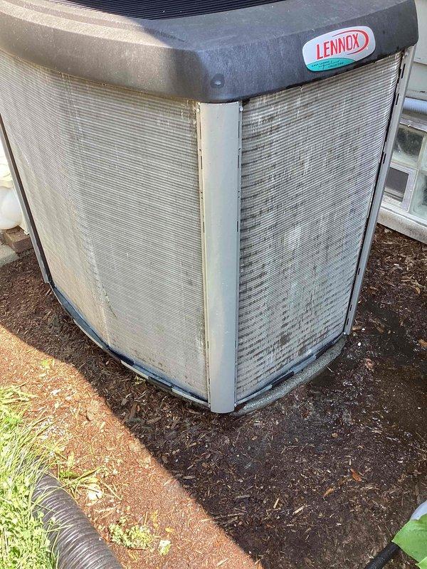 Completed scheduled maintenance on Lennox residential air conditioning condenser unit. Performed system inspection, replaced air filter, and documented unit condition showing dirt and debris accumulation on exterior grilles and panels requiring cleaning attention.